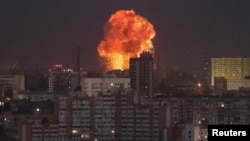 An explosion after a Russian missile strike is seen in the sky over Kyiv early on September 2.