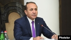 Hovik Abrahamian announces his resignation as prime minister at a cabinet meeting in Yerevan on September 8.