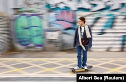 Ukrainian refugee Viktoria Blinova rides a skateboard in Barcelona