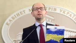 Ukrainian Prime Minister Arseniy Yatsenyuk said that Ukraine was ready for talks with Russia, but that Moscow must withdraw its troops from Crimea and stop its support for "separatists and terrorists."