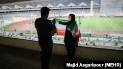 Iranian football fans in Iran watching Iran Spain game via screen