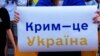 Плакат на акції проти збройної агресії Росії в День Незалежності України. Тбілісі, Грузія, 24 серпня 2022 року