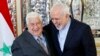 Iranian Foreign Minister Mohammad Javad Zarif (R) greets his Syrian counterpart Walid al-Muallem in Tehran, February 5, 2019