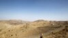 A soldier stands guard along the border fence outside the Kitton outpost on the border with Afghanistan in North Waziristan (file photo)