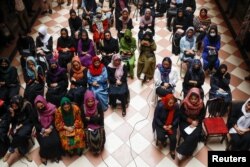 Afghan women attend the inauguration of a women's library in Kabul in August.