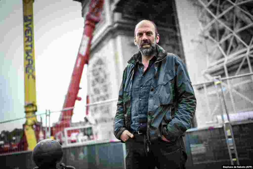 Vladimir Yavachev, the nephew of Christo, poses in front of the Arc de Triomphe. After the wrapping of the arch was delayed due to the coronavirus pandemic, Christo died in May 2020 and the work of overseeing the project fell to Vladimir. Jean-Claude died in 2009. &nbsp; &nbsp; &nbsp;