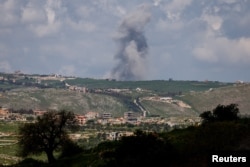 Smoke rises following an air strike in Lebanon, as seen from northern Israel, on April 11.