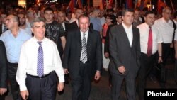 Armenia - Hanrapetutyun party leader Aram Sarkisian (L) and former President Levon Ter-Petrosian (C) lead an opposition demonstration in Yerevan.