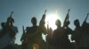 Members of a private security firm pose on the rooftop of a house in Baghdad, Iraq. 