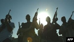 Members of a private security firm pose on the rooftop of a house in Baghdad, Iraq. 