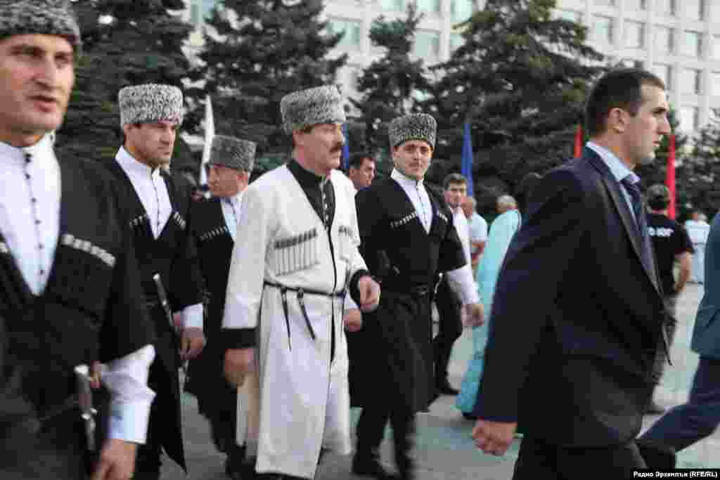 Abdulatipov (center) attended the Constitution Day celebration dressed in a white &quot;cherkeska,&quot; worn by men of many ethnic groups throughout the Caucasus.