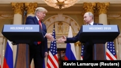 Дональд Трамп и Владимир Путин на пресс-конференции после встречи в Хельсинки, 16 июля 2018 года