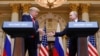 U.S. President Donald Trump (left) and Russian President Vladimir Putin shake hands during a joint news conference after their meeting in Helsinki on July 16.