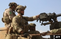 Images from the AFP news agency appear to show U.S. soldiers in Syria wearing the patches of local Kurdish fighters