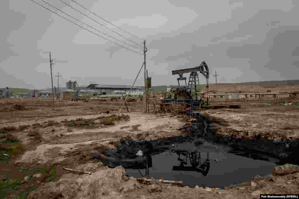 An oil pumpjack in the field near Ilshan's farm.