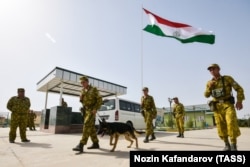 Tajik servicemen from the Panj Border Service guard the Somon border crossing on the Tajik-Afghan border in August 2018.