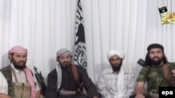 "Ал-Каиданын" Араб жарым аралындагы уюмунун башчылары. Террорчул уюм өткөн жылдын аягында жарыялаган видеотасмадан түшүрүлгөн фотосүрөт.