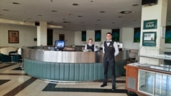Holiday Hotel staff stand ready in July 2020.