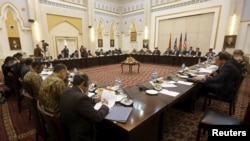 Delegations from Afghanistan, Pakistan, the United States, and China hold a meeting in Kabul on February 23.