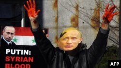 Пікет перад буынкам Рады бясьпекі ААН у Нью-Ёрку супраць падтрымкі Расеяй рэжыму Асада