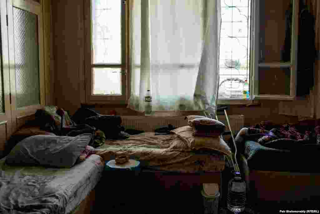 An empty room in the makeshift hospital after wounded Free Syrian Army fighters left for treatment in a Turkish government medical facility. Photographer Petr Shelomovskiy says that, while not officially acknowledging the makeshift facility, the Turkish authorities are aware of its existence. 