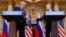 U.S. President Donald Trump (left) and Russian President Vladimir Putin shake hands during a joint news conference after their meeting in Helsinki on July 16.