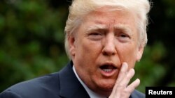 U.S. President Donald Trump talks to reporters as he departs for his trip to Poland and the upcoming G20 summit in Germany, from the South Lawn of the White House in Washington on July 5.