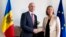 European Union foreign policy chief Federica Mogherini greets Moldovan Prime Minister Pavel Filip prior to their meeting in Brussels on May 3. 