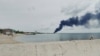 Дым над нефтехранилищем в Феодосии после удара украинских дронов, май 2026 года