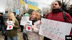 Demonstrators hold banners reading "Lviv speaks Russian language today!" at a rally near the parliament building in Simferopol, Crimea, on February 26.