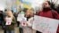 Demonstrators hold banners reading "Lviv speaks Russian language today!" at a rally near the parliament building in Simferopol, Crimea, on February 26.