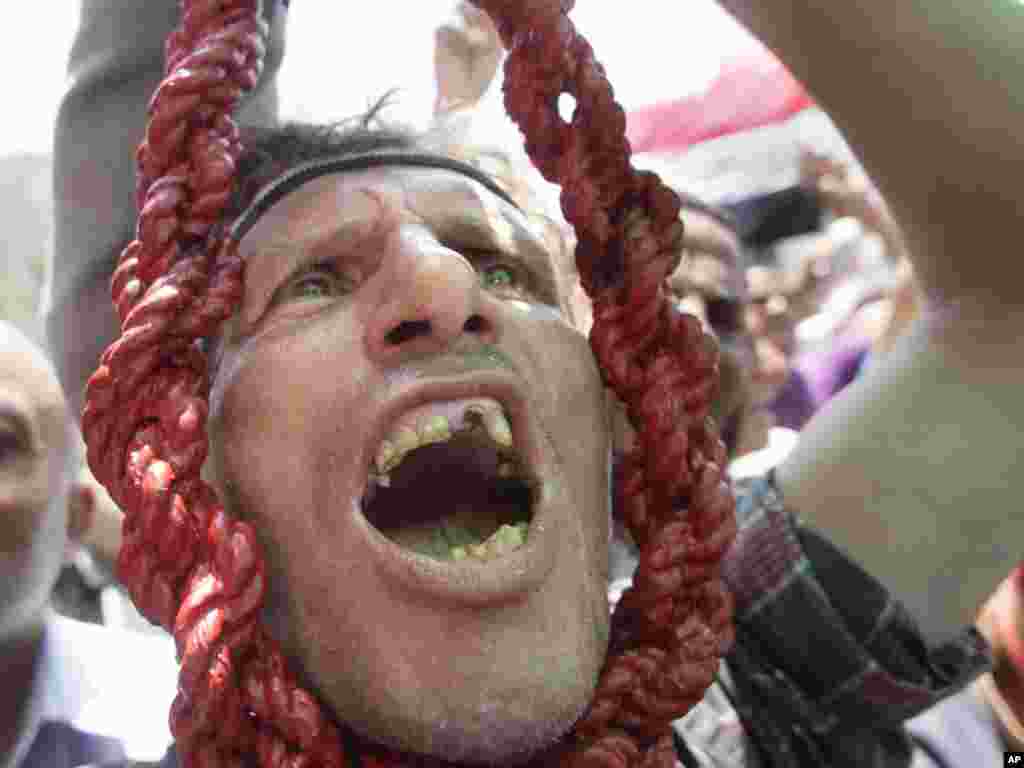 An Egyptian holds a noose as he shouts revenge slogans during a protest in Tahrir Square -- the focal point of the Egyptian uprising -- in Cairo on July 22. The protesters were vowing that they would not leave the square until Egypt's temporary military rulers purge the remnants of Hosni Mubarak's deposed regime.Photo by Amr Nabi fpr AP