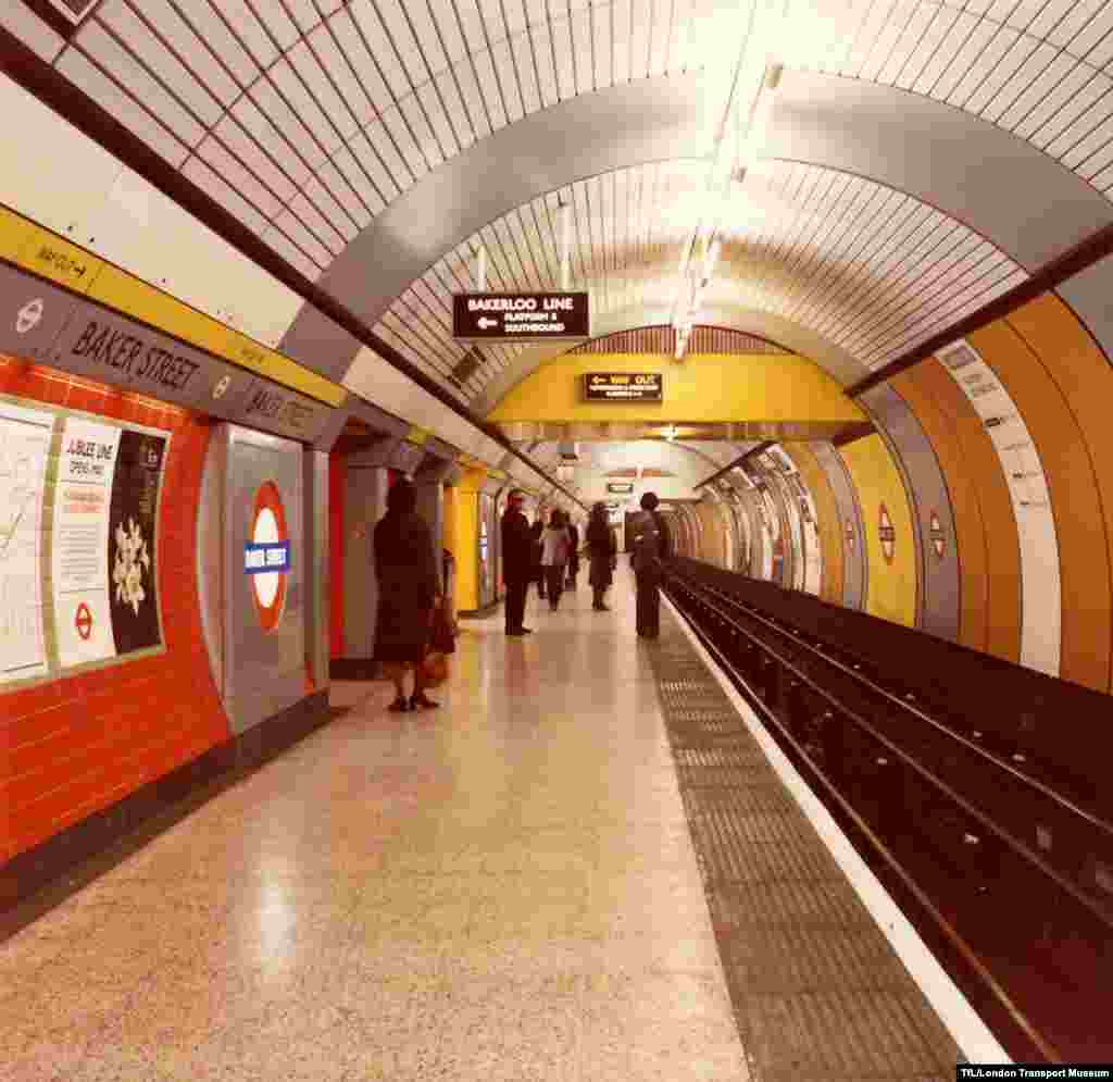 Passengers wait at Baker Street Station.