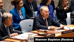 Kazakh President Nursultan Nazarbaev (right) speaks while UN Secretary-General Antonio Guterres looks during a Security Council meeting in New York on January 18.