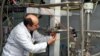 An inspector with the International Atomic Energy Agency checks the uranium-enrichment process inside an Iranian nuclear facility in Natanz. (file photo)