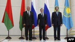 Russian Prime Minister Dmitry Medvedev (center) poses with his Kazakh and Belarusian counterparts, Karim Masimov (right) and Mikhail Myasnikovich, at a meeting in St. Petersburg in June 2012.