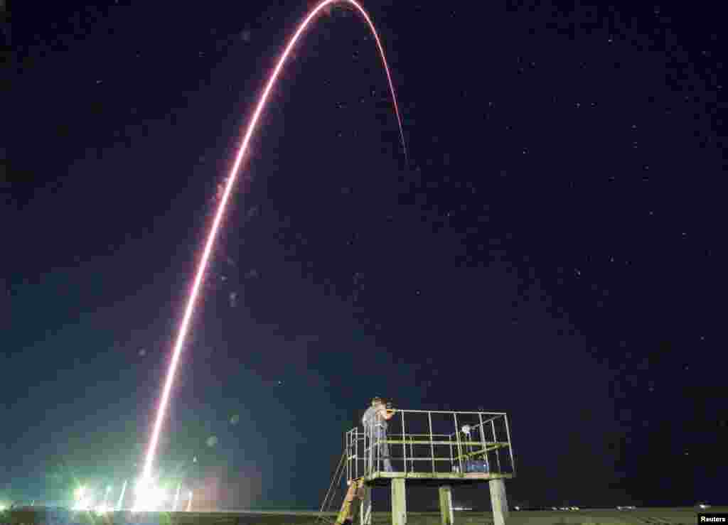 The Soyuz TMA-17M spacecraft carrying International Space Station crew members leaves a trail across the sky on this long exposure photo as it blasts off from the Baikonur Cosmodrome in Kazakhstan. (Reuters/Shamil Zhumatov)