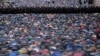 <p>Police stand guard as Muslims pray in a street near the Central Mosque during the Eid al-Adha festival in Moscow. (AFP/Vasily Maximov)</p>
