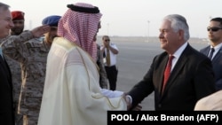 U.S. Secretary of State Rex Tillerson (right) is greeted as he arrives at King Salman Air Base on October 21 in Riyadh, Saudi Arabia. 