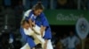 Majlinda Kelmendi (top) of Kosovo and Odette Giuffrida of Italy compete in the women&rsquo;s 52-kilogram judo final. Kelmendi made history by winning Kosovo&rsquo;s first Olympic gold medal.