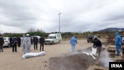 Burial of Covid-19 victims in Iran shows just a handful of family members standing afar and the grave being disinfected. April 3, 2020