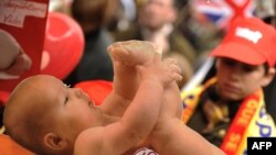 A sign depicting a baby and reading "Get pasionate about life" is raised during a demonstration condemning the Spanish government's liberalization of abortion laws in Madrid in March.