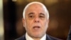 Iraqi Prime Minster Haidar al-Abadi speaks to the press at the airport in Baghdad before leaving for the United States on April 13.