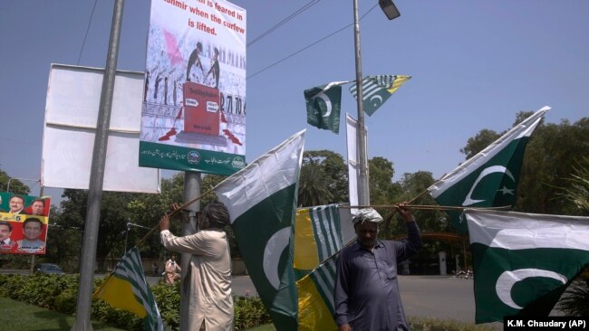 Pakistani and Kashmiri flags are displayed around Lahore, Pakistan, ahead of nationwide anti-India protests. 