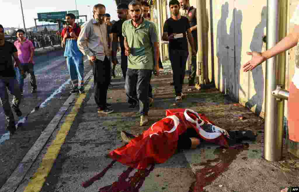 A civilian believed to have been killed by Turkish soldiers lies on the ground on the Bosphorus bridge in Istanbul on July 16.