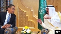 Saudi Arabia's King Abdullah (right) speaks with U.S. President Barack Obama in Riyadh on June 3.