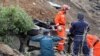 Armenia - A rescue team works at the site of a major landslide, 03Oct2011.