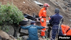Armenia - A rescue team works at the site of a major landslide, 03Oct2011.