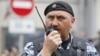 Sergei Kusyuk is seen now serving in Russian special police forces in Moscow in June 2017.