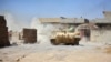 IRAQ -- A tank of Iraqi army fires against Islamic State militants at Al Jazeera neighbourhood of Tal Afar, August 23, 2017